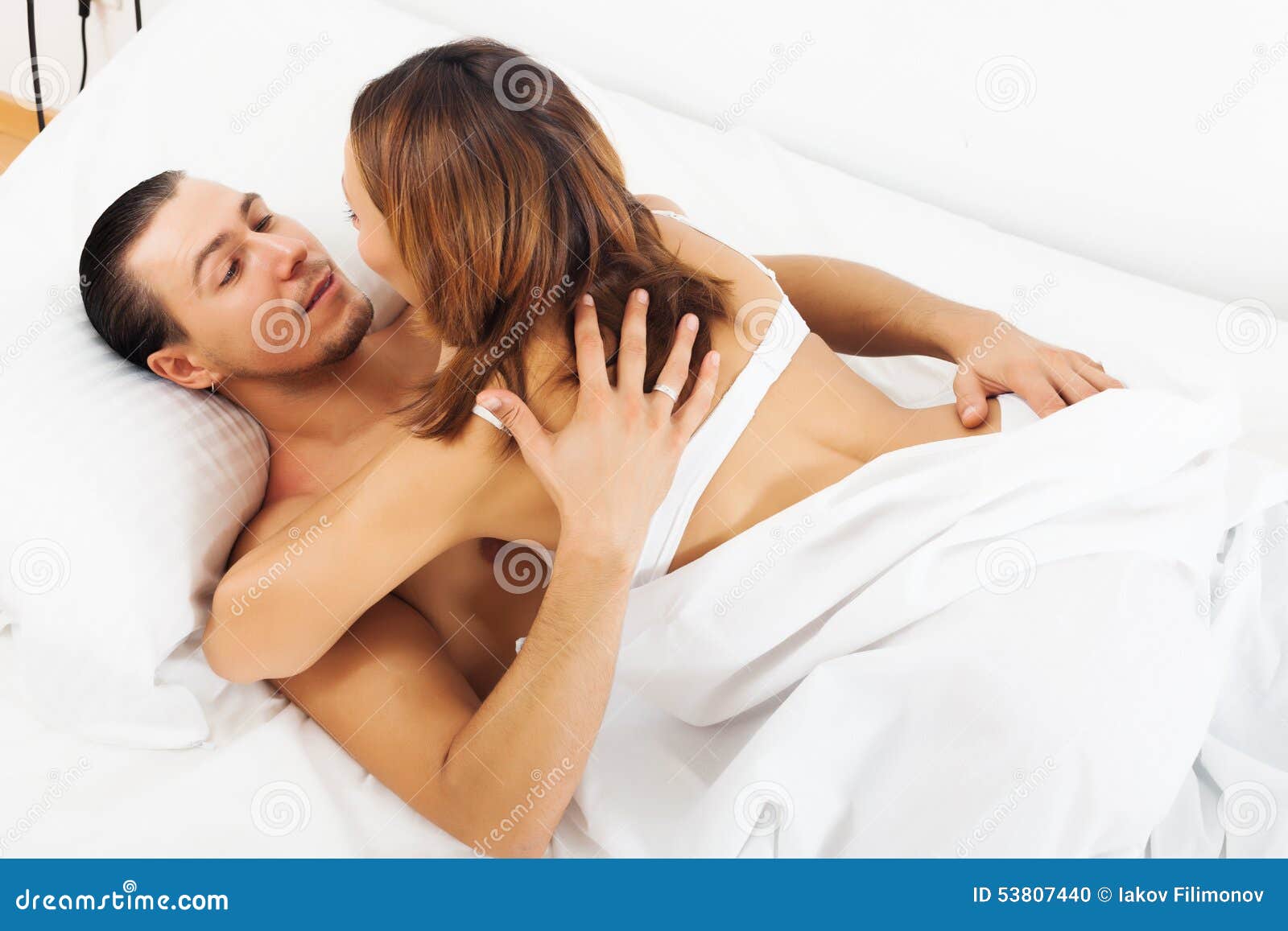 man and woman making love in bed images