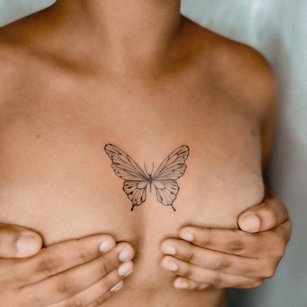 butterfly sternum tattoo