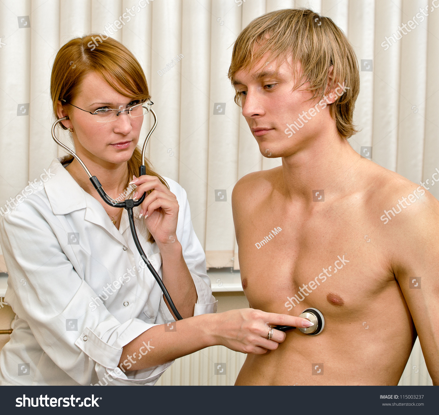 female doctor examining male scrotum