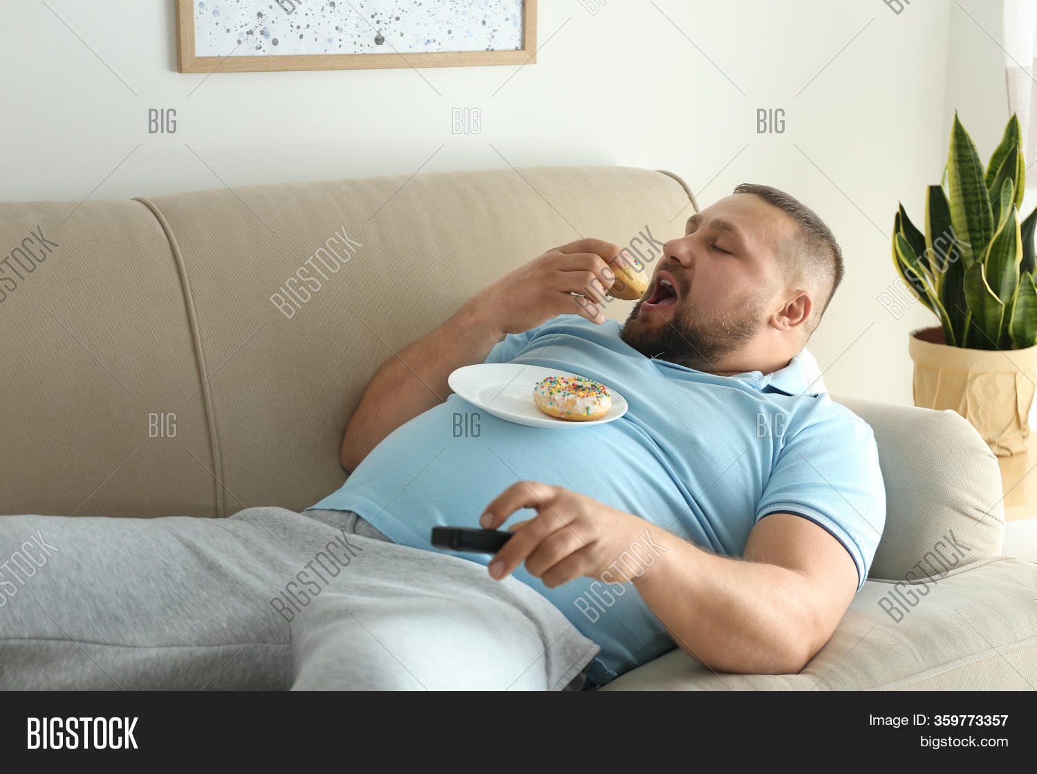 clayton dunbar add photo fat guy on couch
