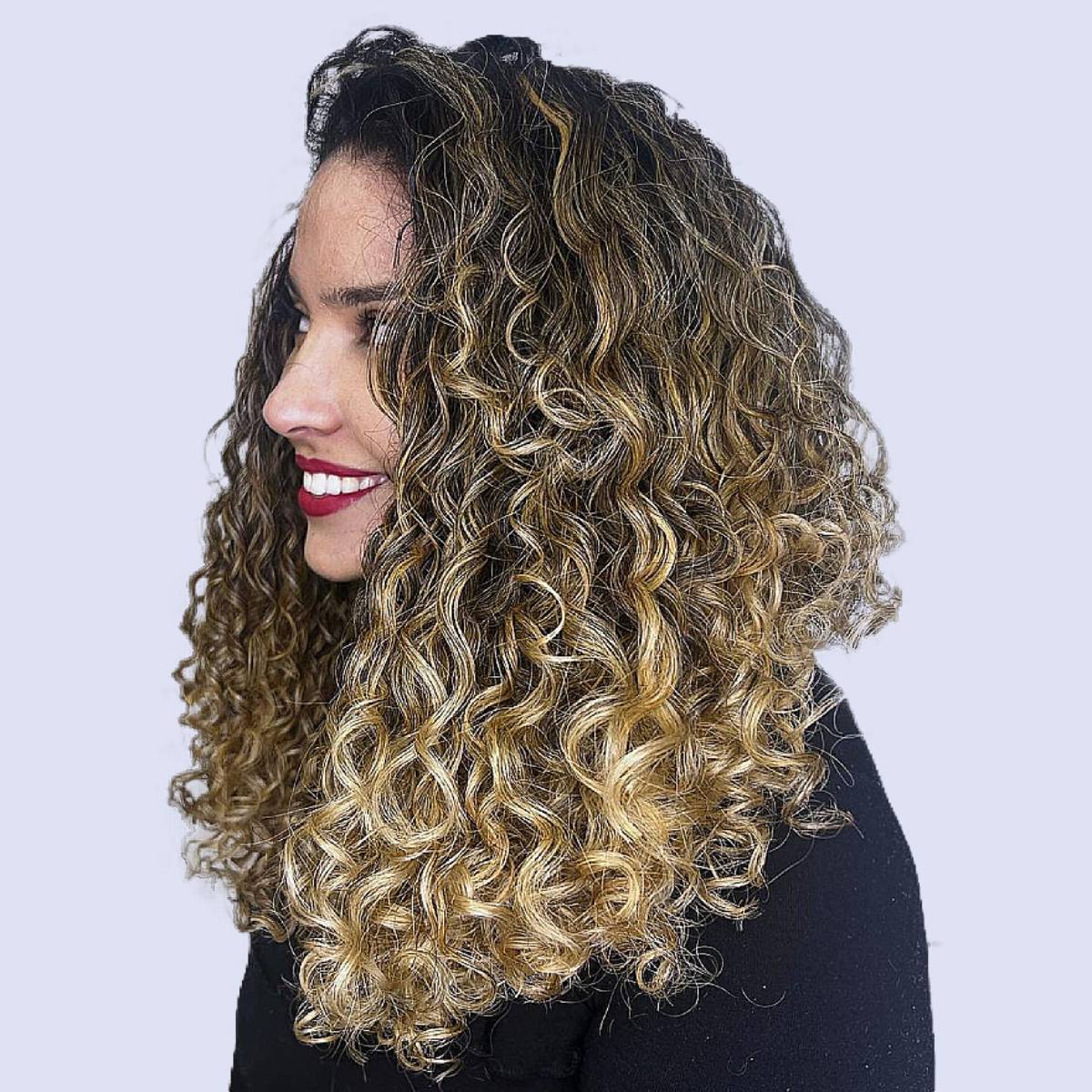 mixed blonde highlights curly hair