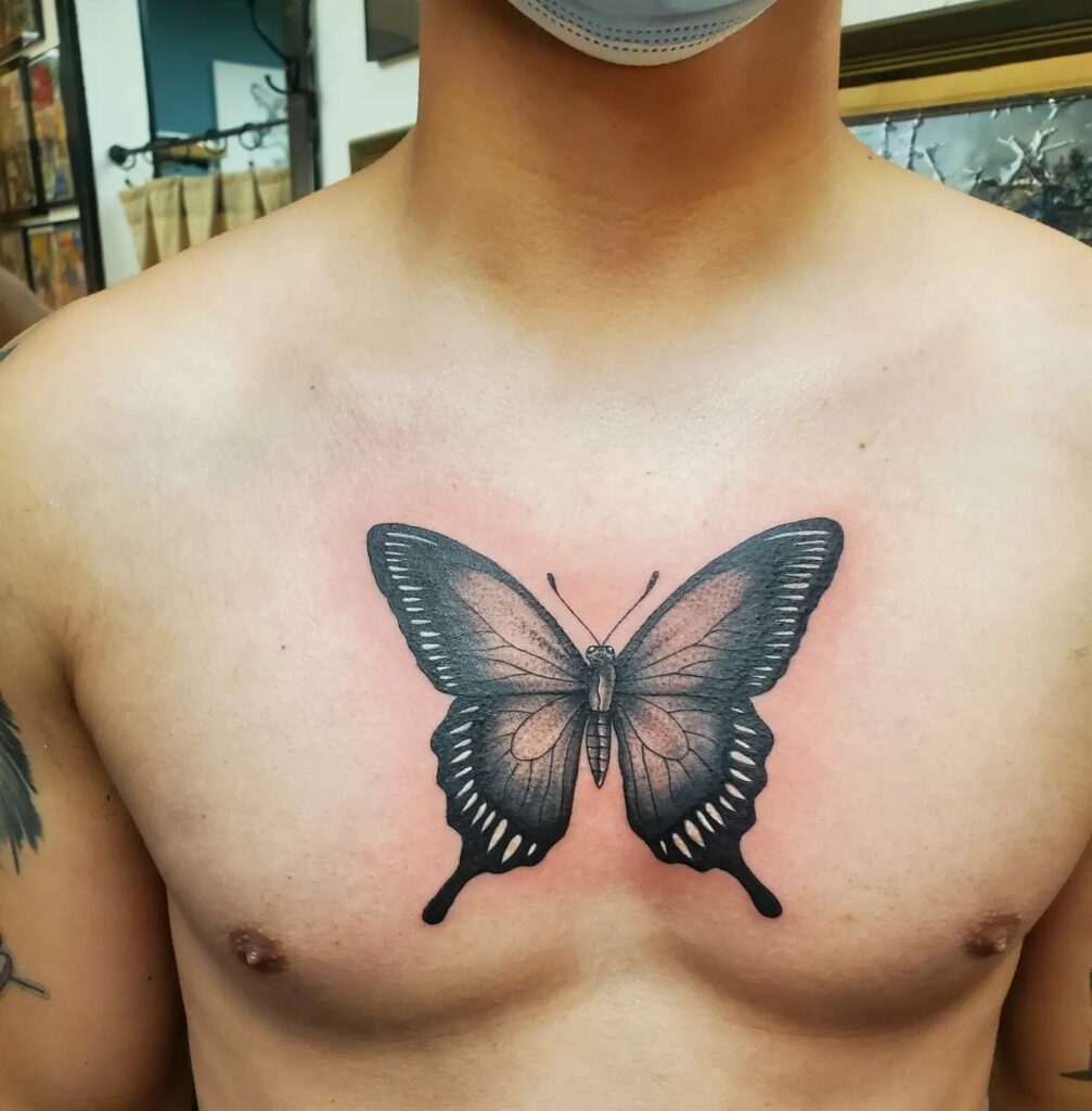 adeyemi george add photo butterfly sternum tattoo