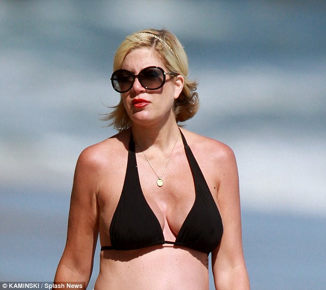 tori spelling’s bare breasts