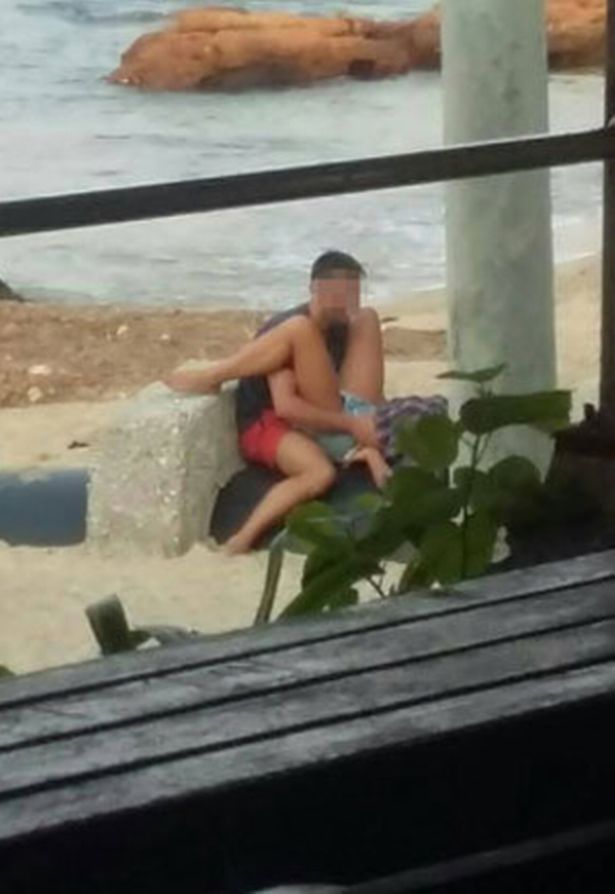 carol mertens add couple caught on beach photo