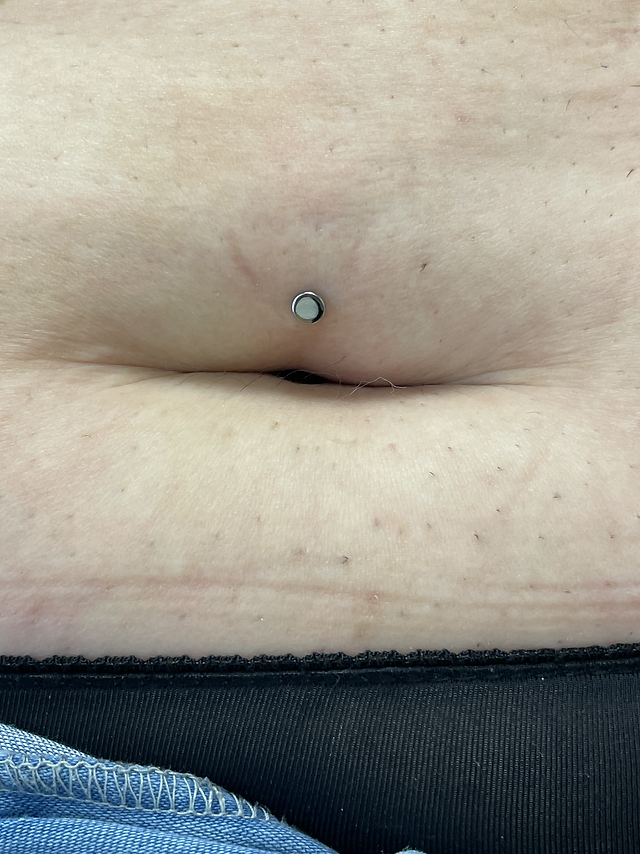 belly button piercing on fat stomach