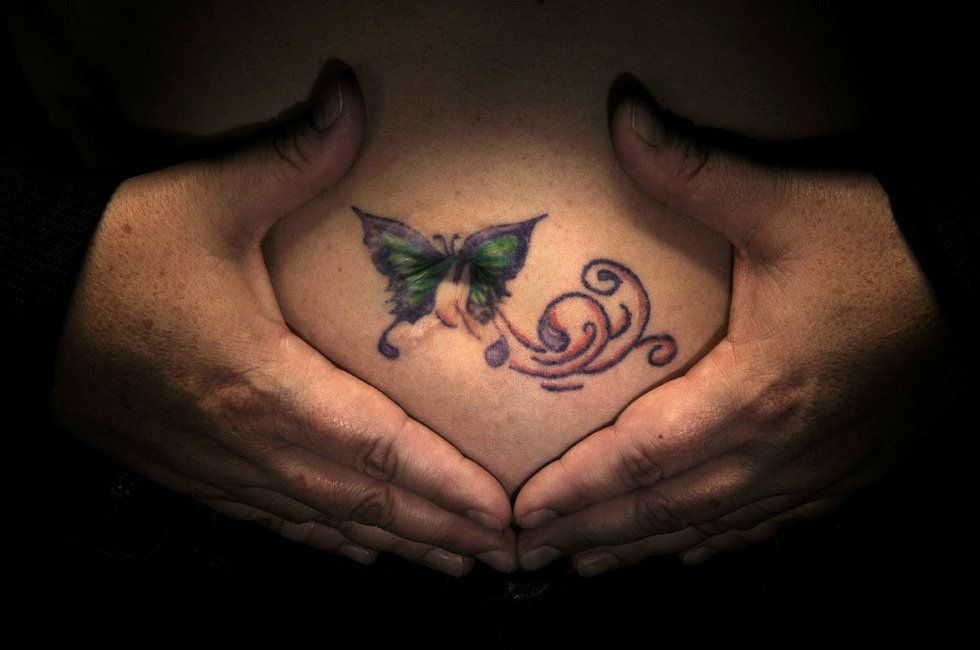 arlene sicard recommends butterfly belly button tattoo pic