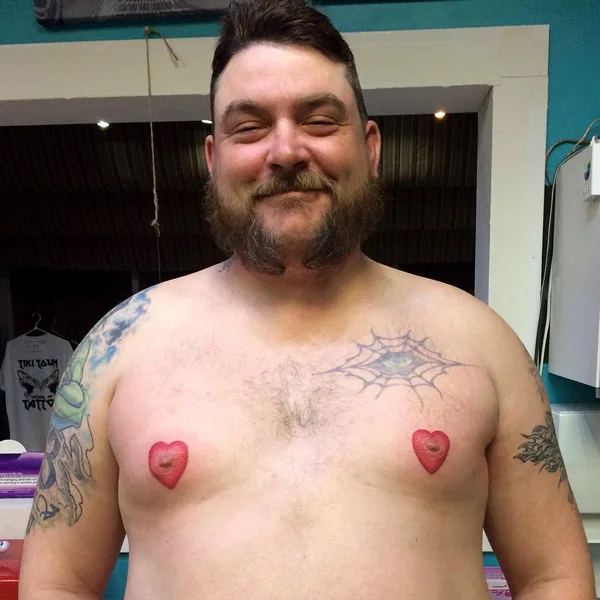 aziz sendi add heart shaped nipples tattoo photo