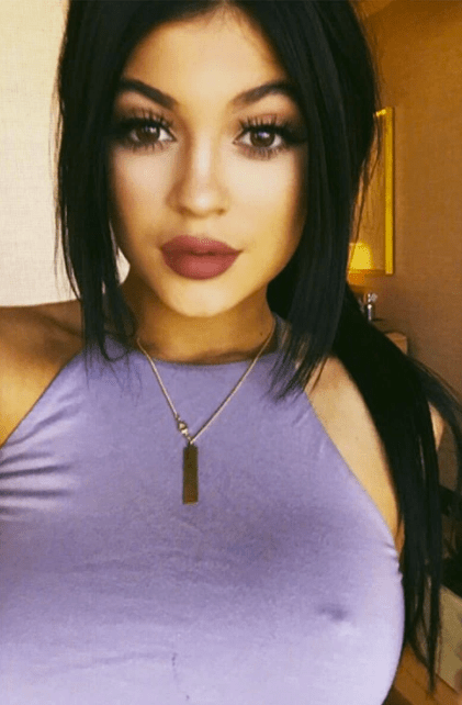andrew volcy add photo kylie jenner flashes boobs