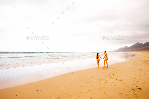 Best of Naked women walking on beach