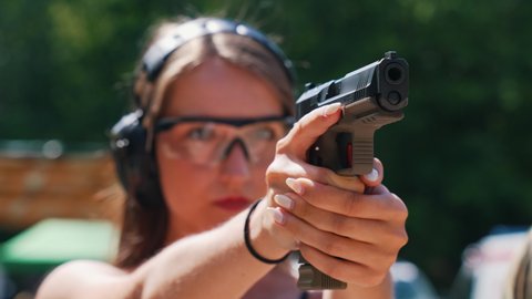 dashing person add photo women shooting guns videos